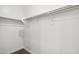 Walk-in closet with clothing rod provides storage solutions at 22565 Rummler Ln, Maricopa, AZ 85138