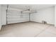 A spacious garage with an automatic door, ready for your vehicles and storage needs at 22565 Rummler Ln, Maricopa, AZ 85138
