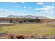 Green community space offers a relaxing open space with views of mountains and landscaping at 22565 Rummler Ln, Maricopa, AZ 85138