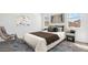 Cozy bedroom featuring a plush bed, neutral colors, and two windows for plenty of natural light at 22565 Rummler Ln, Maricopa, AZ 85138