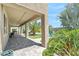 Expansive covered patio overlooks a beautifully landscaped backyard with a sparkling swimming pool, perfect for outdoor entertaining at 23523 N 117Th Dr, Sun City, AZ 85373
