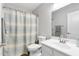 Bathroom featuring a shower/tub combo with a patterned curtain, white vanity with a large mirror at 23523 N 117Th Dr, Sun City, AZ 85373