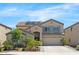 Inviting two-story home featuring a two-car garage, solar panels and desert landscaping at 23523 N 117Th Dr, Sun City, AZ 85373