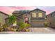 Charming exterior of a two-story home featuring solar panels, a well-manicured lawn, and a two-car garage at 23523 N 117Th Dr, Sun City, AZ 85373