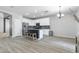 Bright kitchen with white cabinets, stainless steel appliances and a stylish kitchen island at 23523 N 117Th Dr, Sun City, AZ 85373