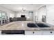 Granite countertops and stainless steel appliances highlight this kitchen with an open floor plan at 23523 N 117Th Dr, Sun City, AZ 85373
