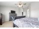 This primary bedroom offers a ceiling fan and ensuite bathroom at 23523 N 117Th Dr, Sun City, AZ 85373