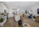 Open-concept kitchen with white cabinets, stainless steel appliances and center island seating at 25139 W Wayland Dr, Buckeye, AZ 85326