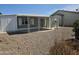 The backyard patio has an aluminum roof with sliding doors to the house at 2528 N Lema Dr, Mesa, AZ 85215