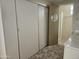 Bathroom showing vanity, cabinets and mirror, plus a view into the en suite tiled shower at 2528 N Lema Dr, Mesa, AZ 85215