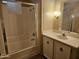 Bathroom featuring a single sink vanity, wall mirror and adjacent tiled shower stall at 2528 N Lema Dr, Mesa, AZ 85215