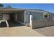 Charming single-story home featuring a well-maintained lawn and cozy covered parking at 2528 N Lema Dr, Mesa, AZ 85215