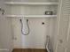 Laundry area featuring hookups for a washer and dryer and additional storage shelves at 2528 N Lema Dr, Mesa, AZ 85215