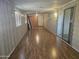 Sunroom featuring wood look laminate floors and a sliding glass door out to the yard at 2528 N Lema Dr, Mesa, AZ 85215