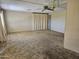 Bright and airy living room with a ceiling fan, perfect for entertaining and relaxation at 2528 N Lema Dr, Mesa, AZ 85215
