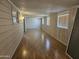 Sunroom featuring wood look laminate floors and several windows providing natural light at 2528 N Lema Dr, Mesa, AZ 85215
