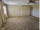 Spacious living room with ample natural light and ceiling fan, ideal for Gathering gatherings at 2528 N Lema Dr, Mesa, AZ 85215