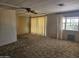 Spacious living room with ceiling fan, offering a comfortable living space at 2528 N Lema Dr, Mesa, AZ 85215