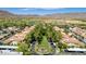 Aerial view of homes, trees, and landscaping within a Primary-planned community, highlighting its serene atmosphere at 2540 N Stone Hill Rd, Buckeye, AZ 85396
