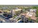 Aerial view showing a community area, with shops, palm trees and greenery at 2540 N Stone Hill Rd, Buckeye, AZ 85396