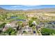 An aerial view showcases the golf course club house and community at 2540 N Stone Hill Rd, Buckeye, AZ 85396