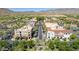 Aerial view showcasing community commercial district near homes with a backdrop of scenic mountains at 2540 N Stone Hill Rd, Buckeye, AZ 85396