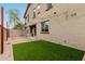 This large backyard features artificial turf and a patio, perfect for outdoor living at 2540 N Stone Hill Rd, Buckeye, AZ 85396
