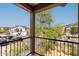 Balcony view of street with houses and trees, on a bright day with clear skies at 2540 N Stone Hill Rd, Buckeye, AZ 85396