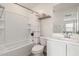 This clean bathroom features a shower over tub, a toilet, and a vanity with sink at 2540 N Stone Hill Rd, Buckeye, AZ 85396