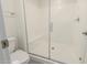 A walk-in shower with a glass door and built-in bench seats are installed in the bathroom at 2540 N Stone Hill Rd, Buckeye, AZ 85396