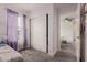 This bedroom features a closet with white sliding doors and purple curtains at 2540 N Stone Hill Rd, Buckeye, AZ 85396