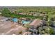 Aerial view showcases a luxury community pool, basketball court and green landscaping at 2540 N Stone Hill Rd, Buckeye, AZ 85396