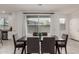 Dining area featuring a table, seating for eight, and a view to the backyard at 2540 N Stone Hill Rd, Buckeye, AZ 85396