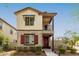 Charming two-story home featuring mixed brick and siding, a small balcony, and a well-maintained front yard at 2540 N Stone Hill Rd, Buckeye, AZ 85396