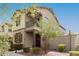 View of a home featuring mixed brick and siding with a small balcony and well-maintained landscaping at 2540 N Stone Hill Rd, Buckeye, AZ 85396