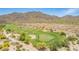 Aerial view of golf course with sand traps and desert landscaping at 2540 N Stone Hill Rd, Buckeye, AZ 85396