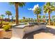 Outdoor cooking area featuring built-in grill, countertop, and nearby community pool at 2540 N Stone Hill Rd, Buckeye, AZ 85396