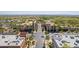 Aerial view of a vibrant shopping center with palm trees and pedestrian-friendly streets at 2540 N Stone Hill Rd, Buckeye, AZ 85396
