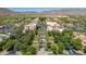 An aerial shot shows the shopping district with lush trees and the mountains in the background at 2540 N Stone Hill Rd, Buckeye, AZ 85396