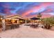 Enjoy outdoor dining in the Arizona sunshine in this wonderful backyard featuring a pool, bar and patio area at 3733 E Kachina Dr, Phoenix, AZ 85044