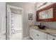 Well-lit bathroom featuring a vessel sink, granite countertop, and soaking tub at 3733 E Kachina Dr, Phoenix, AZ 85044