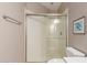 Bathroom featuring frameless glass shower doors, rain shower head, and tile floors at 3733 E Kachina Dr, Phoenix, AZ 85044