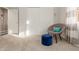 Spacious bedroom with chair and ottoman next to closet with sliding doors at 3733 E Kachina Dr, Phoenix, AZ 85044