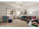 Bright bedroom featuring modern sofa, desk, chair, and plush carpet at 3733 E Kachina Dr, Phoenix, AZ 85044