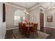 Elegant dining room with hardwood floors, area rug and chandelier at 3733 E Kachina Dr, Phoenix, AZ 85044