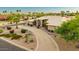 A pristine single-story home offers curb appeal, featuring a circular driveway and beautiful landscaping at 3733 E Kachina Dr, Phoenix, AZ 85044