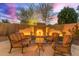 Enjoy this outdoor living space featuring an elegant fireplace and seating at 3733 E Kachina Dr, Phoenix, AZ 85044