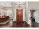 Elegant foyer with dark hardwood floors and adjacent dining area at 3733 E Kachina Dr, Phoenix, AZ 85044
