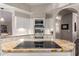 Modern kitchen with granite countertops, a flat cooktop, and stainless steel appliances at 3733 E Kachina Dr, Phoenix, AZ 85044