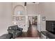 Living room featuring vaulted ceilings, wood floors, and easy access to other parts of the home at 3733 E Kachina Dr, Phoenix, AZ 85044